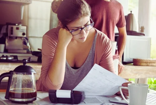 How Bankruptcy Affects Your Credit Score and How to Rebuild It in Nevada 1 Unhappy stressed young female dressed casually doing domestic budget, paying bills online. Bankruptcy Affects Your Credit Score